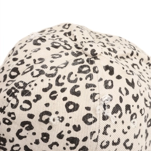 Macro view of leopard print baseball cap featuring vintage distressed fabric details