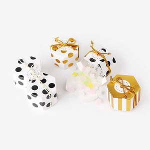 Mini hexagonal chocolate gift boxes in dot and stripe patterns with elegant strings
