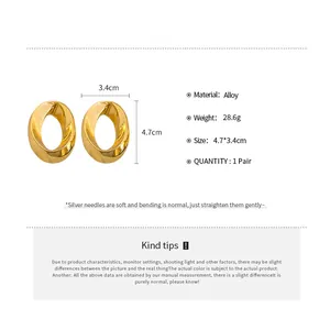 Detail showing dimensions of 4.7x3.4cm for these stylish gold-toned oval knot earrings