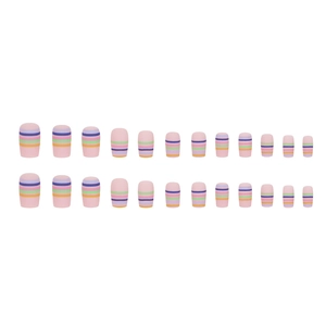 Short square press-on nails set featuring colorful rainbow stripes and matte pink base