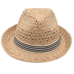 Retro hollow straw cowboy hat with a black and white striped ribbon on a white background