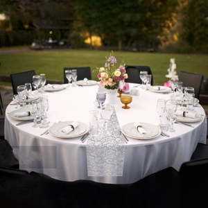 Elegant gold foil mesh table runner with floral patterns for outdoor wedding banquets
