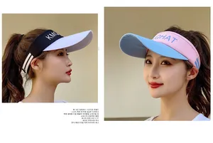 Detail of color-block sun visor hats with KMGO embroidery for outdoor summer sports