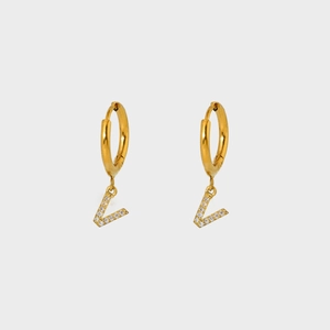 Close-up of gold-plated hoop earrings featuring a V-shaped pendant with pavé zircon stones