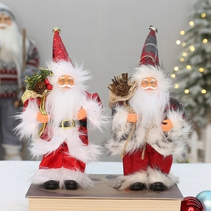 Standing Santa Claus figurines in red sequins and grey plaid outfits for holiday decor