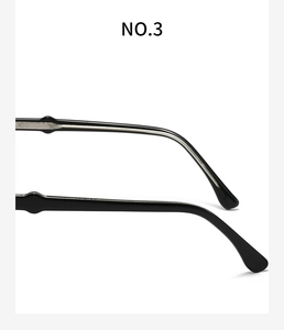 Detailed close-up of the black eyeglass temple with metal core and curved end design