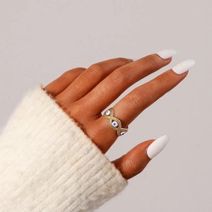 Minimalist gold stainless steel evil eye open ring with blue and white enamel details
