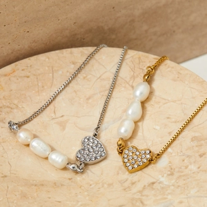 Adjustable heart charm pearl stainless steel bracelet in gold and silver finish