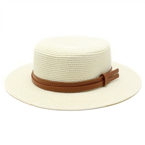 Detail of cream woven straw boater hat featuring a brown faux leather decorative band