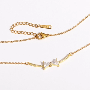 18K gold plated stainless steel bow necklace featuring sparkling white zircon stones