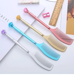 Creative diamond-topped comb pens in pink, gold, blue, and silver on white desk surface
