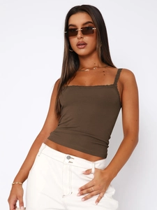 Detail of slim-fit brown camisole featuring delicate lace trim on neckline and straps