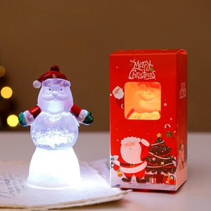 Glowing Santa Claus mini night light ornament with festive red Merry Christmas gift box
