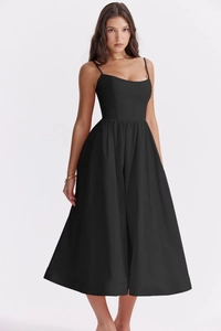 Detailed view of the backless design and slim waist of this elegant black summer midi dress