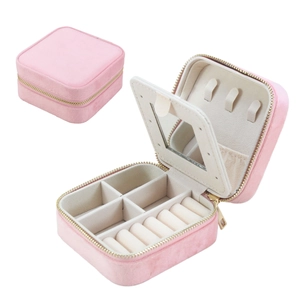 Pink velvet jewelry box detail showing mirror, necklace hooks and ring storage slots