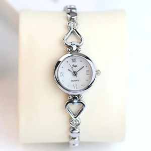 Elegant silver quartz watch for women with heart-shaped bracelet and rhinestone details