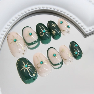 Short oval forest green press-on nails with glitter star and bow metallic accents