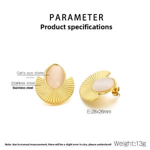 Detailed view of square gold fan earrings with textured steel and beige cat's eye stone