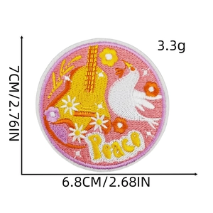 Macro shot of 7cm Peace patch with guitar and dove embroidery for laptop and luggage