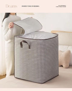 Detail of houndstooth storage bag showing large capacity for thick winter blankets