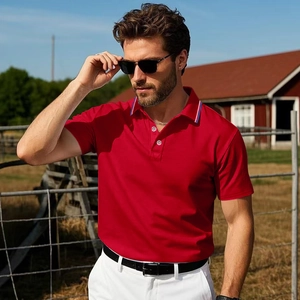 Detailed view of a red short-sleeved polo shirt with striped collar on a male model outdoors