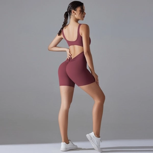 Detail of burgundy yoga jumpsuit featuring backless design and scrunch butt lifting effect