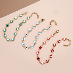 Detail of adjustable evil eye bead bracelets with lobster clasps and gold chain links