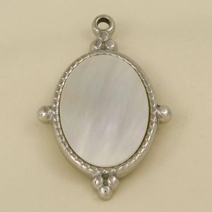 Detailed view of oval stainless steel pendant with white mother of pearl inlay
