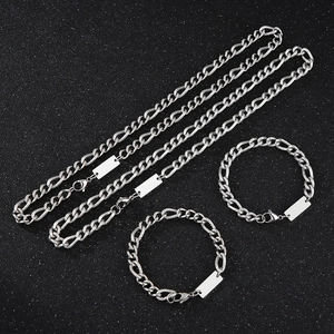 Silver Figaro chain set with two necklaces, two bracelets, and blank metal pendants