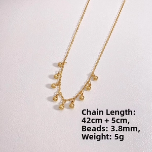 Detailed spec view of a gold beaded fringe necklace showing 42cm length and 3.8mm beads