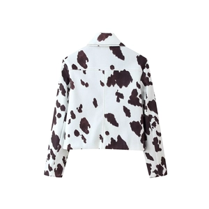 Women's casual cropped jacket featuring a black and white cow print from the back view