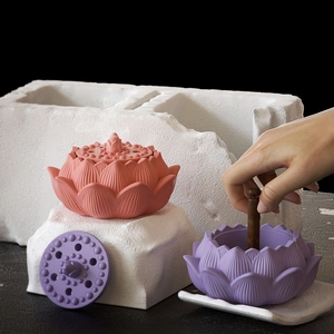 Close-up of pink and purple lotus shaped resin silicone molds with floral textures