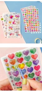 Macro shot of colorful heart-shaped washi stickers and English lettering for journaling