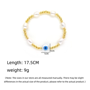 Baroque pearl and evil eye beaded bracelet with gold accents and 17.5CM length detail