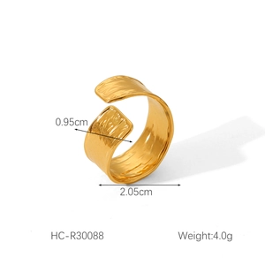 Detail shot of golden hammered finish stainless steel ring with 0.95cm width dimensions