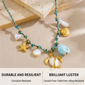 Detail of beach-style woven necklace featuring golden starfish, turtle and seashell charms