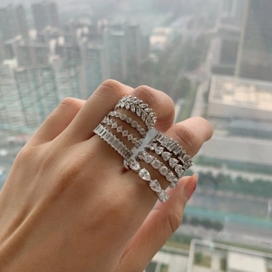 Elegant S925 sterling silver rings with zircon heart and flower shapes on model's hand