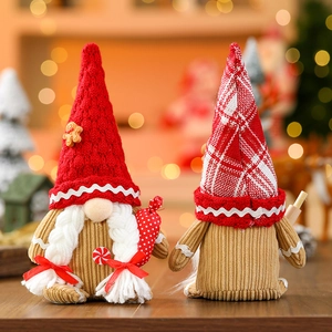 Detailed view of handmade Christmas gnomes with gingerbread and candy cane decorations