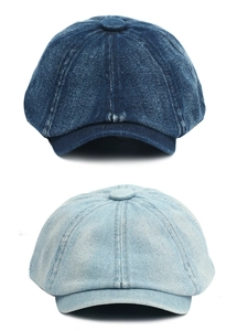 Detail of premium washed denim newsboy caps in dark and light blue with stitched panels