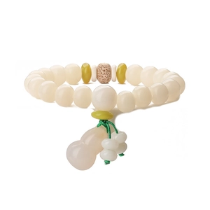 Detailed view of white Bodhi root beads with a pink jade gourd pendant on green cord
