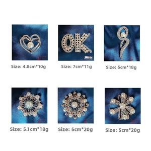 Detailed size chart for six gold-toned brooches with pearls and sparkling rhinestones