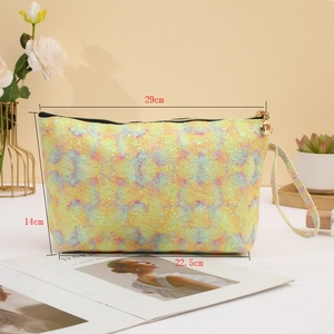 Detailed view of lace makeup bag with dimensions 29cm upper width and 14cm height