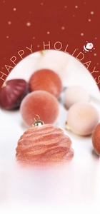 Close-up of red flocked Christmas ball ornaments with wave texture and gold metal caps