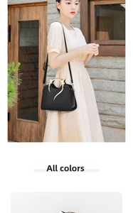 Detail of black leather handbag featuring golden cat-ear metal handles and adjustable strap