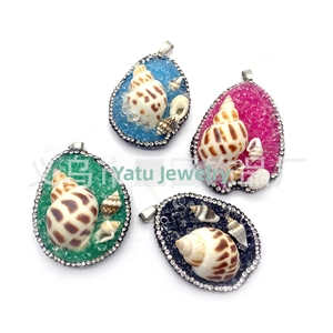 Detailed view of teardrop pendants with natural shells and colorful resin stone inlay