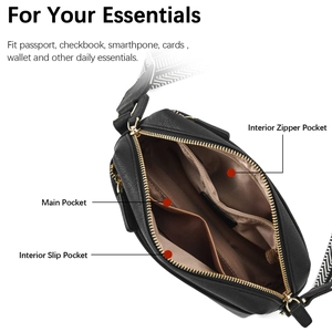 Internal view of black leather crossbody bag showing pockets and geometric strap