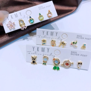 Close-up of S925 silver stud earrings set featuring colorful zircons and cute animal shapes