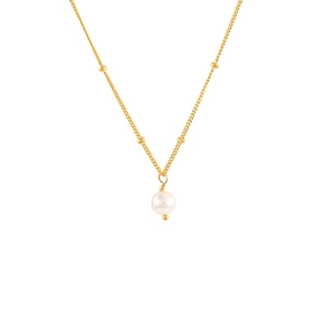 Detail of gold plated Y-shaped necklace with white pearl pendant and gold beads