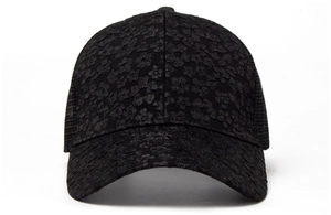 Close-up of delicate black floral lace embroidery detail on a breathable mesh baseball cap