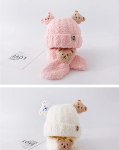 Detail of baby bear beanie and scarf set featuring soft coral fleece in pink and white
